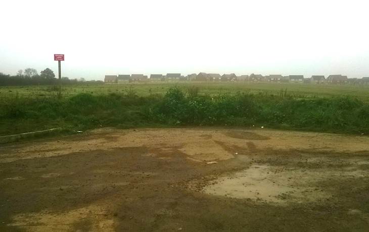 Geot1_view of site with houses in background